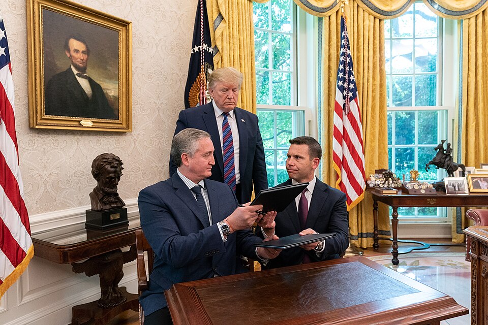U.S. President Donald Trump watches as Guatemalan Minister of the Interior Enrique Degenhart (left) and U.S. Acting Secretary of Homeland Security Kevin K. McAleenan (right) 